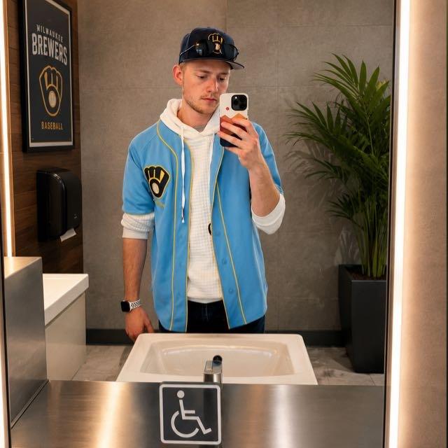 Zac Rains photographing his reflection in a mirror
